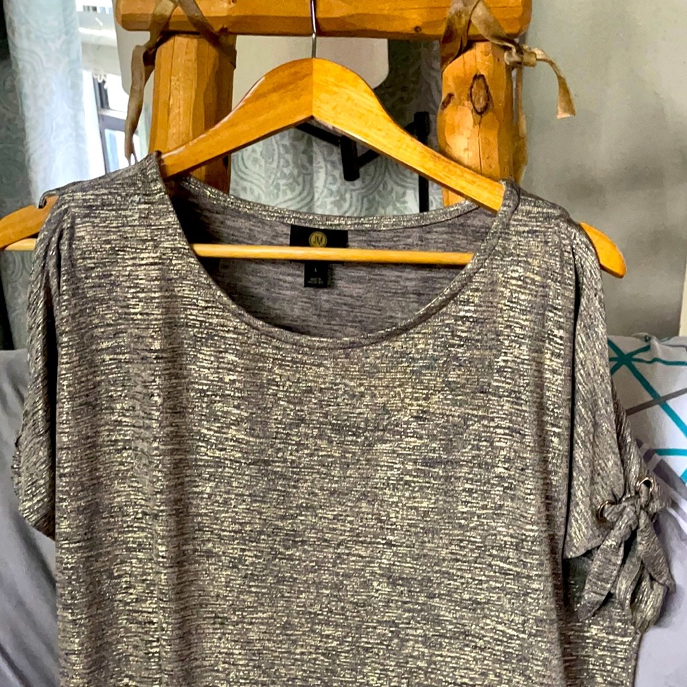 This is a beautiful blouse. Whom ever adds this to their closet will to
